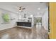 Open-concept living space featuring a modern kitchen with stainless steel appliances and sleek countertops at 1311 W Perdiz St, Tampa, FL 33612
