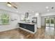 Bright kitchen featuring granite countertops, stainless steel appliances, and an open layout at 1311 W Perdiz St, Tampa, FL 33612