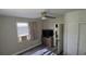 Bedroom featuring an air conditioner, ceiling fan, neutral walls, and wood-look floors at 13330 Fort King Rd, Dade City, FL 33525