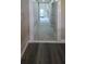 Hallway with wood flooring and white trim throughout at 13330 Fort King Rd, Dade City, FL 33525