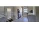 Kitchen with stainless steel refrigerator and a window at 13330 Fort King Rd, Dade City, FL 33525