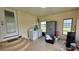Bright laundry room with washer, dryer, and ample storage space with a neutral color scheme throughout at 13330 Fort King Rd, Dade City, FL 33525