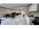 Spacious living area with kitchenette, offering flexible living and dining options at 13330 Fort King Rd, Dade City, FL 33525