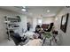 Large studio space featuring tiled floors, work stations, and neutral walls at 13330 Fort King Rd, Dade City, FL 33525