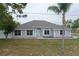 Charming single-story home featuring well-maintained landscaping and a freshly painted exterior at 13551 Banner Rd, Spring Hill, FL 34609