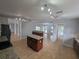 Bright kitchen with wood cabinets, granite countertops, stainless appliances and a large island at 13551 Banner Rd, Spring Hill, FL 34609