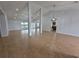 Spacious living area featuring vaulted ceilings, recessed lighting, and seamless access to outdoor spaces at 13551 Banner Rd, Spring Hill, FL 34609