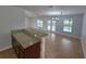 Bright and airy living area with views of the pool and sliding glass doors that lead outside at 13551 Banner Rd, Spring Hill, FL 34609