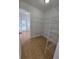 Spacious pantry featuring wood-look floors and wire shelving for optimal storage at 13551 Banner Rd, Spring Hill, FL 34609