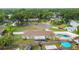 This aerial view shows the backyard pool and mature landscaping at 1410 Moss Laden Ct, Brandon, FL 33511
