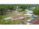 This aerial view shows the backyard pool and mature landscaping at 1410 Moss Laden Ct, Brandon, FL 33511