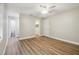 Bedroom with wood-look flooring and access to a bathroom and closet at 1410 Moss Laden Ct, Brandon, FL 33511