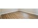 Bedroom with wood-look flooring and white baseboards at 1410 Moss Laden Ct, Brandon, FL 33511