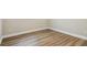 Bedroom with wood-look flooring and white baseboards at 1410 Moss Laden Ct, Brandon, FL 33511