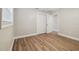 Bedroom showcasing closet space, window, neutral walls, and wood-look floors at 1410 Moss Laden Ct, Brandon, FL 33511
