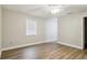 A bedroom with wood-look flooring and a ceiling fan at 1410 Moss Laden Ct, Brandon, FL 33511
