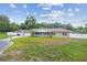 Charming single-story home with manicured lawn and attached two-car garage at 1410 Moss Laden Ct, Brandon, FL 33511