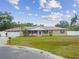 Charming single-story home with manicured lawn and attached two-car garage at 1410 Moss Laden Ct, Brandon, FL 33511