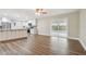 Open-concept kitchen and living area featuring stainless steel appliances and wood-look floors at 1410 Moss Laden Ct, Brandon, FL 33511