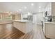 Bright, airy kitchen with a large island, stainless appliances, and open access to other rooms at 1410 Moss Laden Ct, Brandon, FL 33511