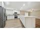 Modern kitchen featuring stainless steel appliances, white cabinets, and a central island at 1410 Moss Laden Ct, Brandon, FL 33511