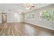 Bright and airy living room featuring new flooring, neutral walls, and plenty of natural light at 1410 Moss Laden Ct, Brandon, FL 33511
