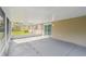 Large enclosed patio with a concrete floor and view of the backyard at 1410 Moss Laden Ct, Brandon, FL 33511