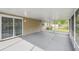 Enclosed patio featuring a sliding glass door leading to the backyard at 1410 Moss Laden Ct, Brandon, FL 33511