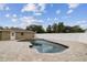 Inviting in-ground pool features an expansive brick patio, offering a perfect backyard for outdoor relaxation and entertainment at 1410 Moss Laden Ct, Brandon, FL 33511