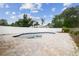A tranquil in-ground pool with a spacious brick patio, surrounded by a privacy fence, offering a serene backyard retreat at 1410 Moss Laden Ct, Brandon, FL 33511