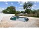 A captivating in-ground pool is the focal point of this backyard retreat, perfect for relaxation and enjoying sunny days at 1410 Moss Laden Ct, Brandon, FL 33511