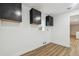 Bright utility room with black cabinets, neutral walls, and modern flooring at 1410 Moss Laden Ct, Brandon, FL 33511