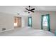 Bright, spacious bedroom with tile floors, a ceiling fan, and plenty of natural light at 1695 Cinnamon Ln, Dunedin, FL 34698
