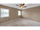 Bedroom with two windows with blinds providing lots of natural light at 1695 Cinnamon Ln, Dunedin, FL 34698