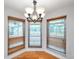 Breakfast nook with many windows providing natural light and wood floors at 1695 Cinnamon Ln, Dunedin, FL 34698