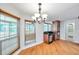 Bright breakfast nook with wood floors, lots of windows, and views of the lanai at 1695 Cinnamon Ln, Dunedin, FL 34698
