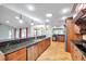 Spacious kitchen with granite countertops, stainless steel appliances, and ample cabinet space at 1695 Cinnamon Ln, Dunedin, FL 34698