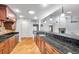 Spacious kitchen with custom cabinets, granite countertops, and stainless steel appliances at 1695 Cinnamon Ln, Dunedin, FL 34698