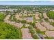 Aerial view of the neighborhood, showcasing the beautiful landscaping and pond views at 17527 Stinchar Dr, Land O Lakes, FL 34638