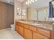 Double sinks and granite counters in this Primary bathroom at 17527 Stinchar Dr, Land O Lakes, FL 34638