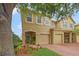 Charming two-story townhome with well-manicured landscaping and a two-car garage at 17527 Stinchar Dr, Land O Lakes, FL 34638