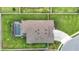 Aerial view of the home featuring a backyard pool, patio, and driveway at 18079 Romanesque Ct, Spring Hill, FL 34610