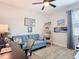 Inviting bedroom with a comfortable sofa, workspace, and bright natural light at 18079 Romanesque Ct, Spring Hill, FL 34610