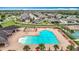 Aerial shot of the community pool, lounge chairs, clubhouse and playground at 18079 Romanesque Ct, Spring Hill, FL 34610