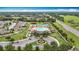 Aerial view of the community pool, clubhouse, tennis courts, and playground at 18079 Romanesque Ct, Spring Hill, FL 34610