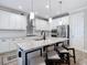 Spacious kitchen with stainless steel appliances, granite counters, and an island with bar seating at 18079 Romanesque Ct, Spring Hill, FL 34610
