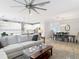 Open-concept space featuring a living room, dining area, and kitchen with seamless flow at 18079 Romanesque Ct, Spring Hill, FL 34610