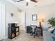 Bright home office featuring a ceiling fan, gray walls, stylish desk and comfortable seating at 18079 Romanesque Ct, Spring Hill, FL 34610