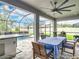 Entertainer's patio with outdoor kitchen, dining area and pool at 18079 Romanesque Ct, Spring Hill, FL 34610