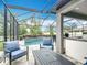 Entertainer's patio with summer kitchen and pool at 18079 Romanesque Ct, Spring Hill, FL 34610